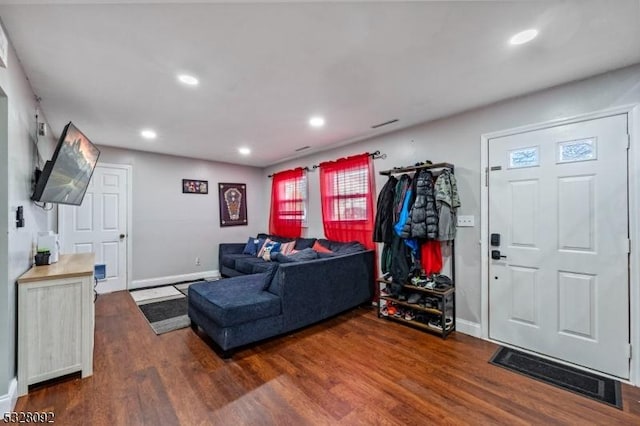 living room featuring dark hardwood / wood-style flooring