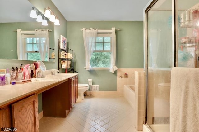 full bathroom with tile patterned flooring, plus walk in shower, vanity, and toilet