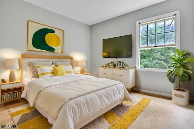 bedroom with light hardwood / wood-style flooring