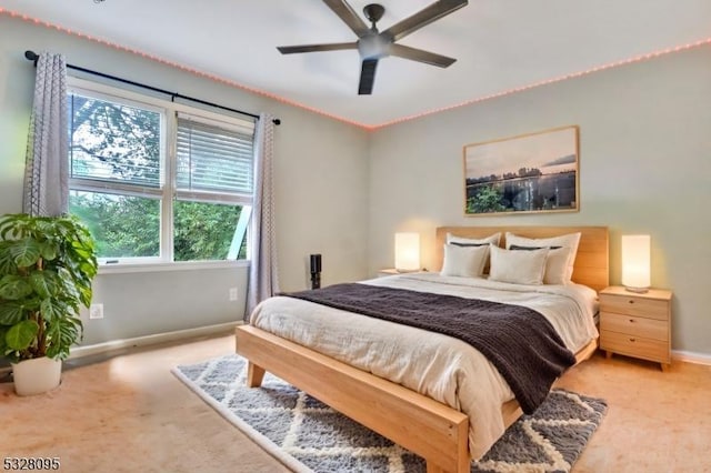 bedroom with ceiling fan and carpet floors