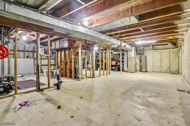 basement featuring gas water heater and heating unit