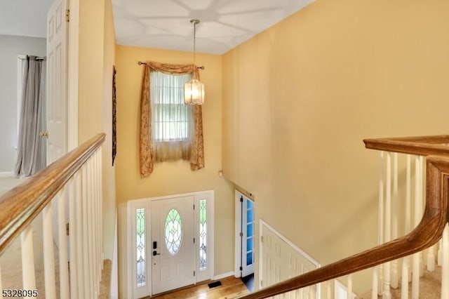 foyer featuring an inviting chandelier