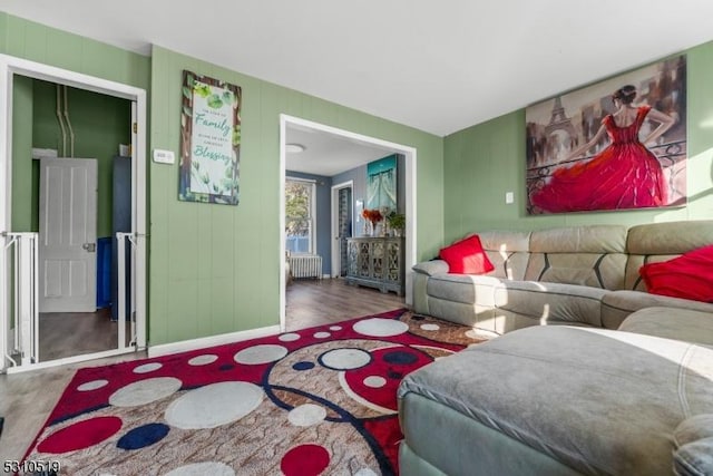 living room featuring hardwood / wood-style flooring and radiator heating unit