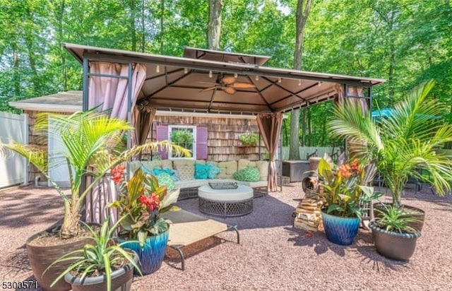 view of patio / terrace with a gazebo and an outdoor living space with a fire pit