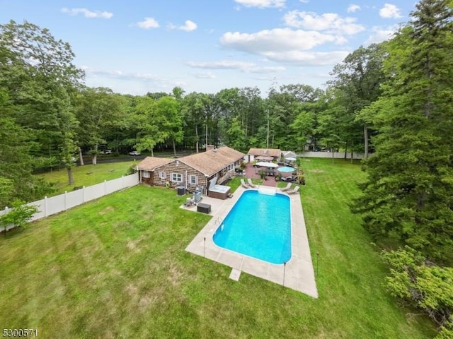 view of pool with an outdoor hangout area, a patio, and a lawn