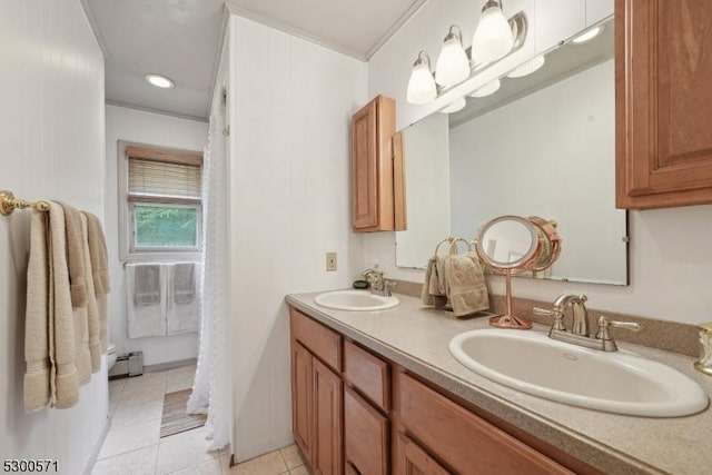 bathroom with baseboard heating, tile patterned flooring, vanity, and ornamental molding