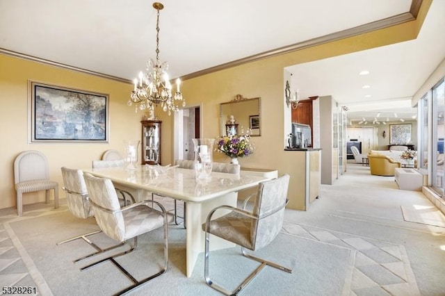 dining space featuring a notable chandelier, light colored carpet, and ornamental molding