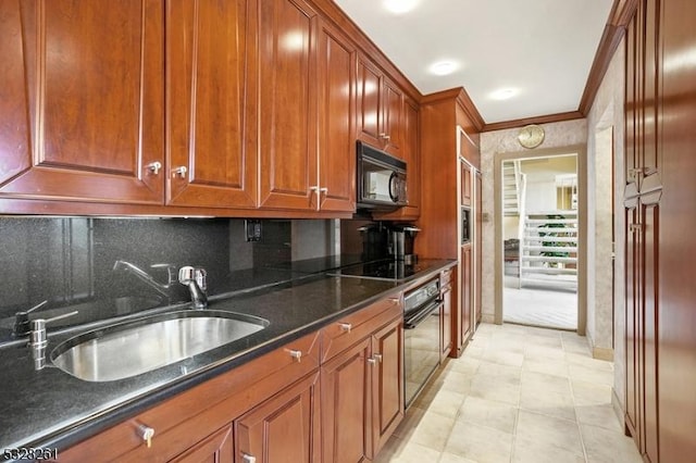 kitchen featuring dark stone counters, black appliances, crown molding, sink, and decorative backsplash