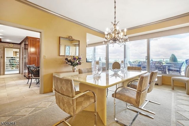 carpeted dining area featuring a chandelier and crown molding