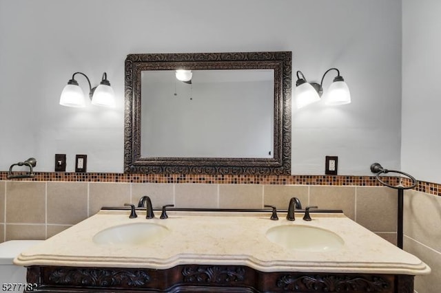 bathroom featuring vanity and tile walls