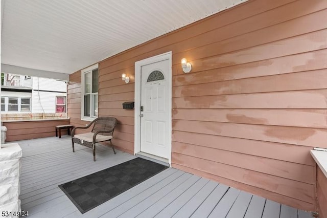 wooden terrace featuring a porch