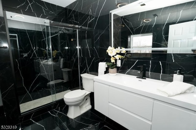 bathroom with tasteful backsplash, an enclosed shower, toilet, vanity, and tile walls