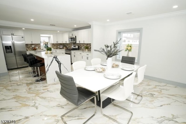 dining room with crown molding