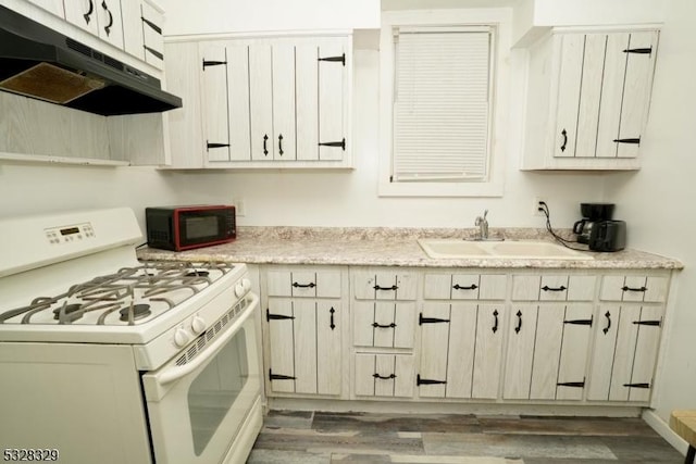 kitchen featuring sink, white range with gas stovetop, and dark wood-type flooring