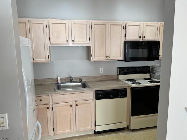 kitchen featuring light countertops, a sink, white appliances, and light brown cabinetry