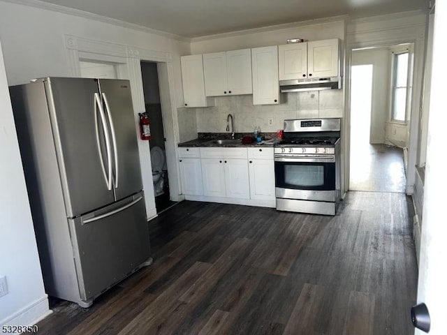 kitchen with white cabinetry, sink, dark hardwood / wood-style floors, backsplash, and appliances with stainless steel finishes