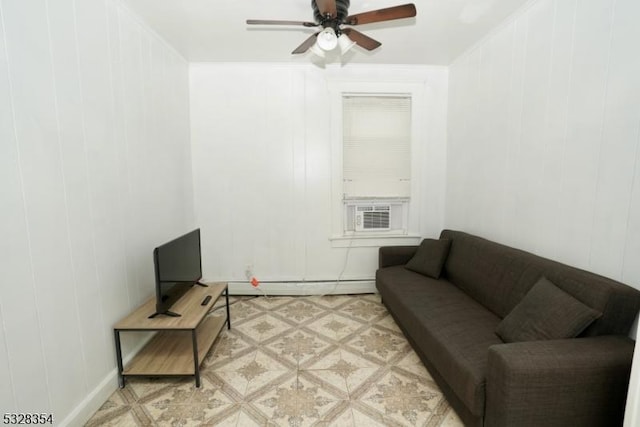 living room featuring crown molding, baseboard heating, cooling unit, and ceiling fan