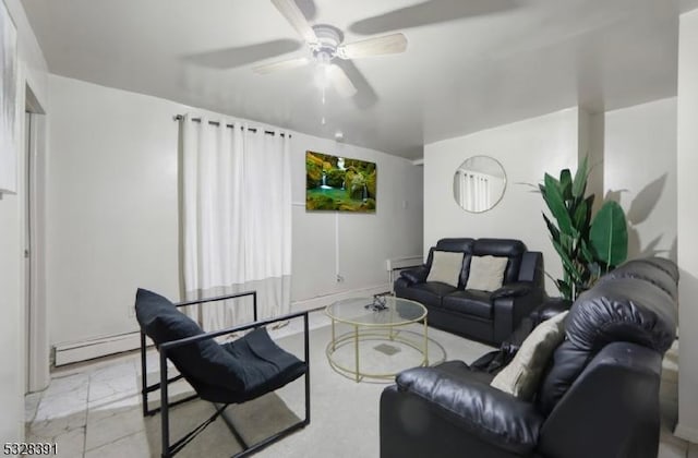 living room with ceiling fan and a baseboard heating unit