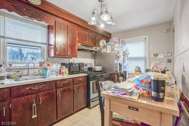 kitchen with sink, an inviting chandelier, stainless steel range oven, decorative light fixtures, and light tile patterned flooring