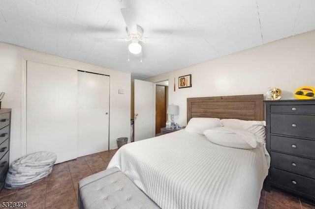 bedroom featuring ceiling fan and dark tile patterned floors