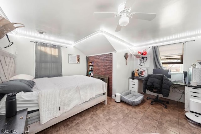 bedroom with ceiling fan, radiator heating unit, tile patterned flooring, lofted ceiling, and a fireplace