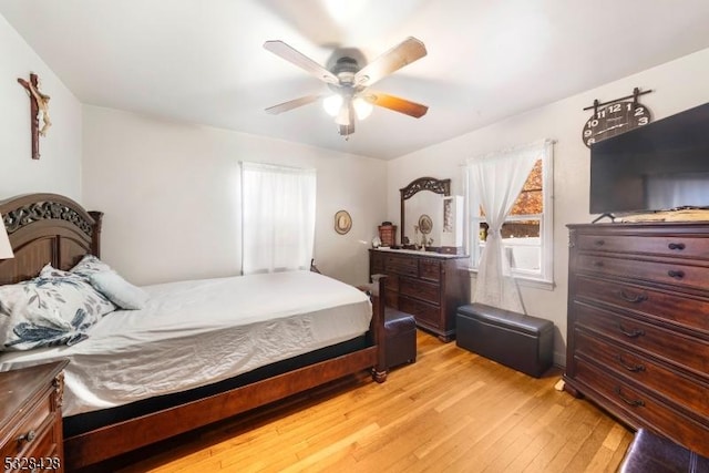 bedroom featuring light hardwood / wood-style flooring and ceiling fan