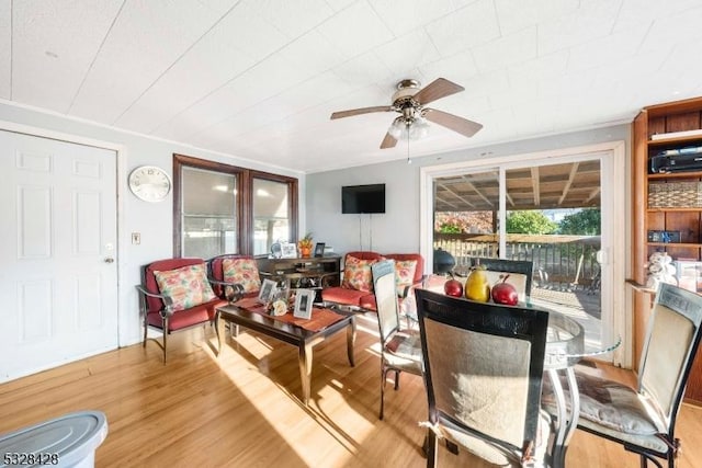 sunroom featuring ceiling fan