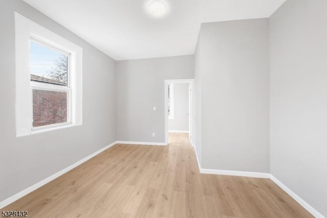 spare room with light hardwood / wood-style flooring