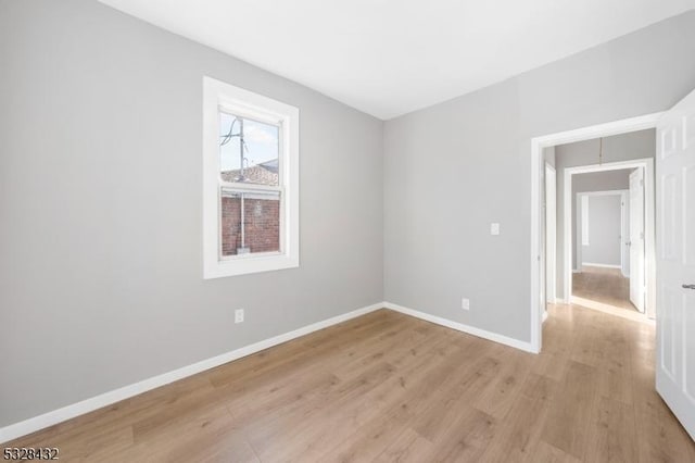 spare room featuring light wood-type flooring