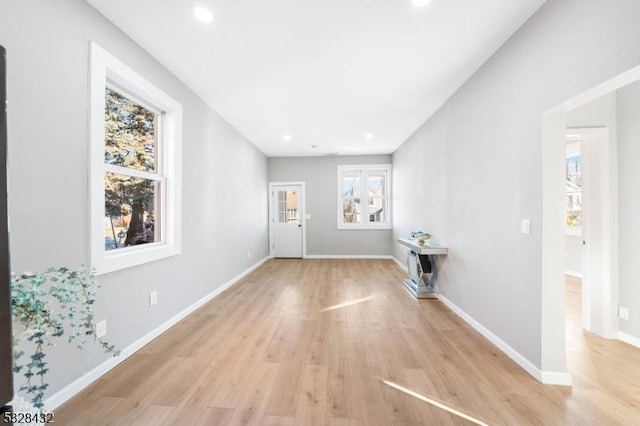 unfurnished living room with light wood-type flooring