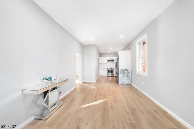 unfurnished living room featuring light hardwood / wood-style flooring