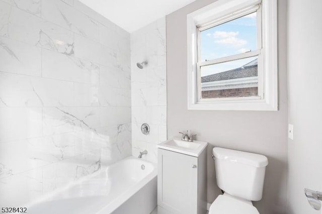 full bathroom with vanity, toilet, and tiled shower / bath