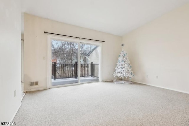 spare room featuring carpet