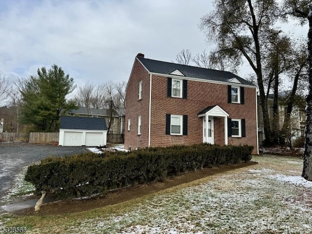 view of front of house featuring an outbuilding and a garage