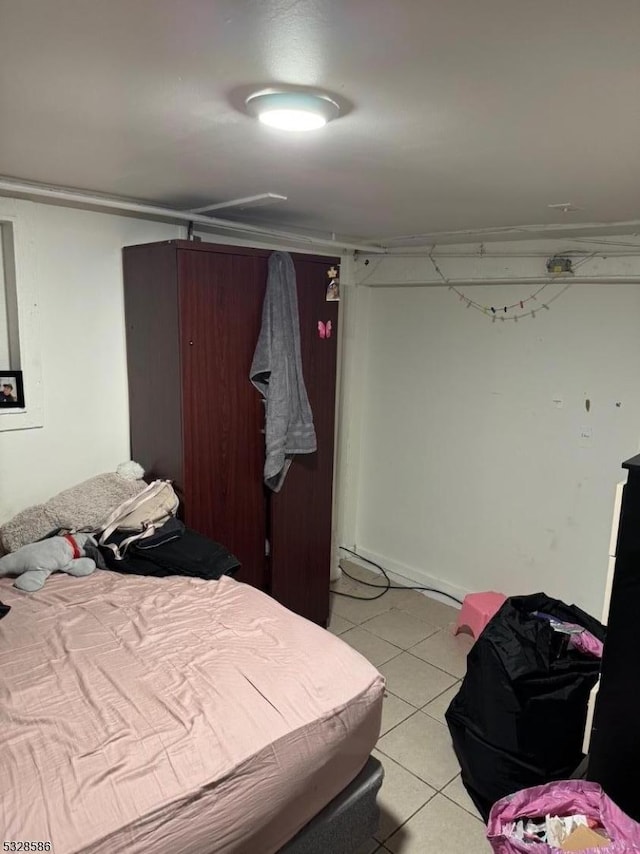 bedroom featuring light tile patterned floors