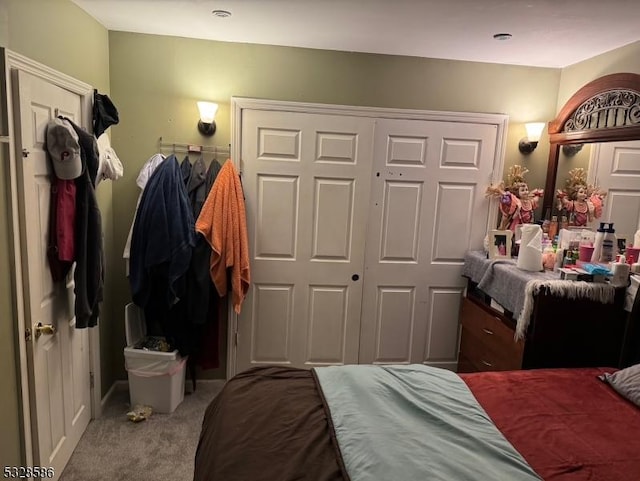 carpeted bedroom featuring a closet