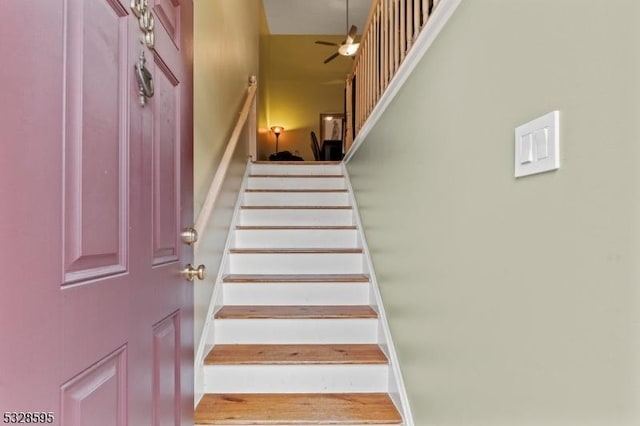 staircase with ceiling fan