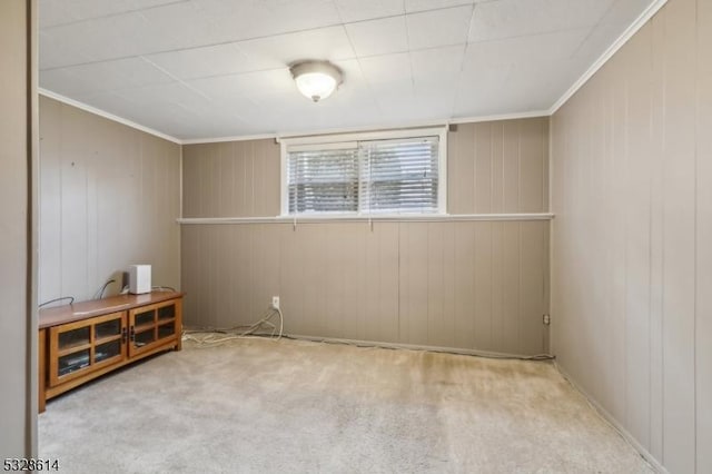 spare room with light carpet and ornamental molding