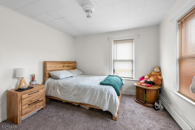 carpeted bedroom featuring multiple windows