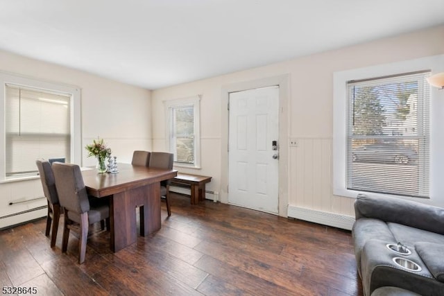 dining room featuring dark hardwood / wood-style floors and a baseboard radiator