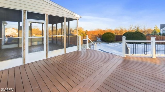 deck with a sunroom