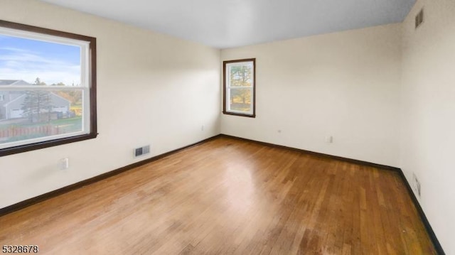 empty room featuring wood-type flooring