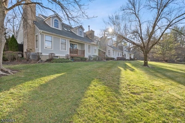 new england style home with a front lawn