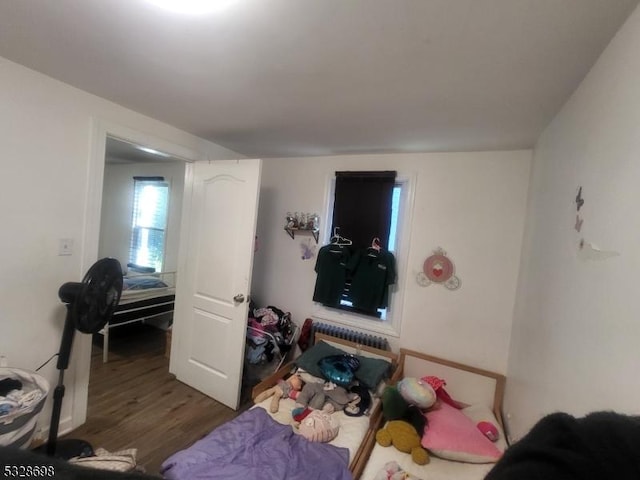 82 Palm St, Newark City, NJ 07106 - bedroom featuring wood finished floors and radiator