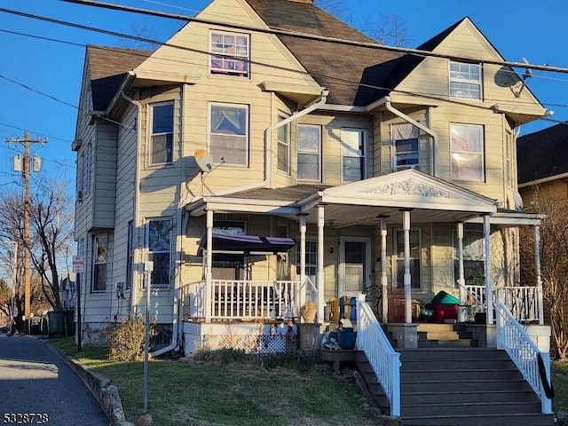 view of front of property featuring covered porch