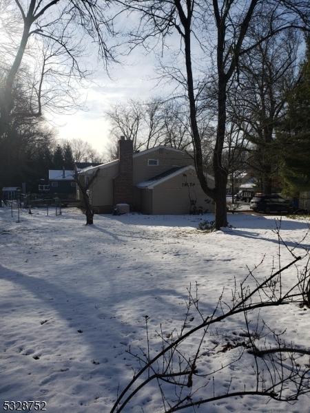 view of yard layered in snow