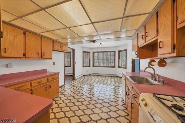 kitchen featuring a paneled ceiling, white range oven, a baseboard radiator, and sink