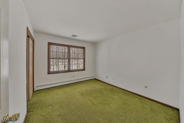 spare room featuring carpet floors and a baseboard radiator