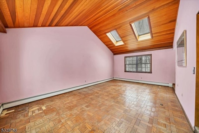 bonus room with light parquet flooring, wood ceiling, a baseboard heating unit, and vaulted ceiling with skylight