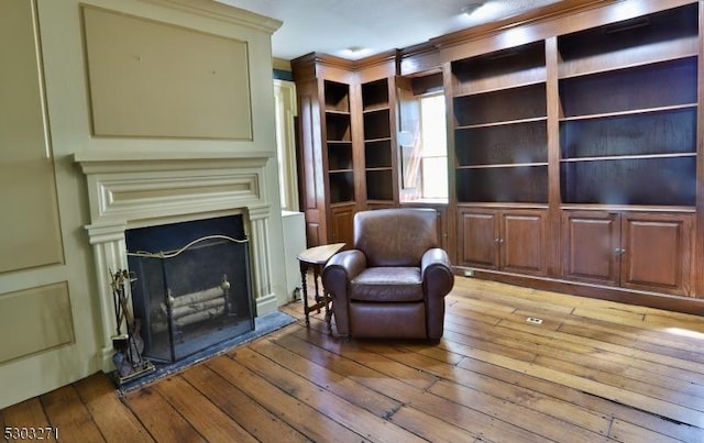 sitting room featuring light wood-type flooring